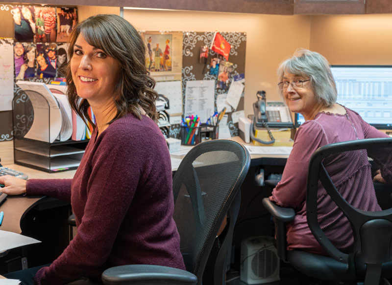 Smiling woman sitting at a desk