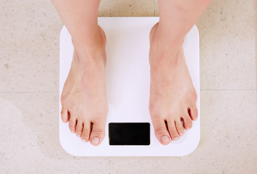 Person standing on bathroom scale